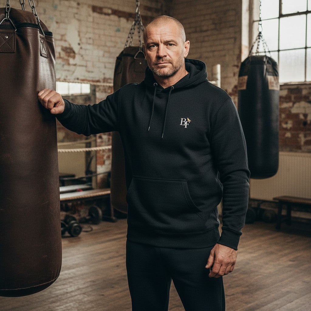 Knockout Champ Pigeon Hoodie – Black front view | Bird Folk